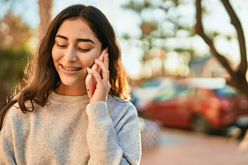 teen on mobile phone