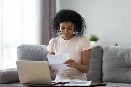 woman looking at financial statement