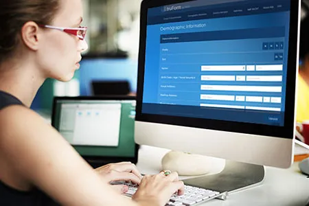 woman filling in online patient registration